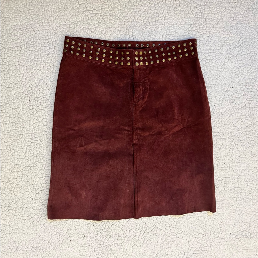 Red leather skirt with button studded waist.